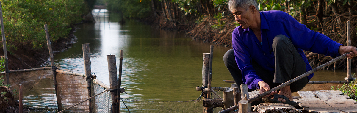 Local farmer at his sustainable shrimp farm. Credit GIZ, Harald Franzen