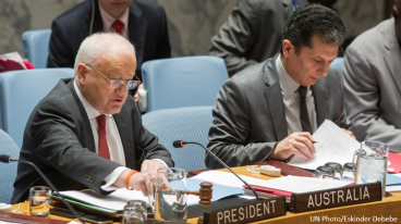 International Policy and Strategies Faculty image - UN photo by Eskinder Debebe of 2 men sitting at the UN table with signs in front that read 'President' and 'Australia'